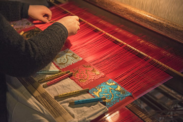 Unidentified women weaving traditional chinese silk in Wuzhen, China