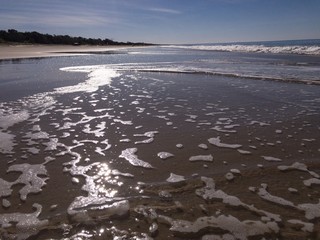 Waves run over an ocean beach
