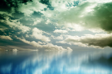 Fototapeta na wymiar Blue sky with clouds over sea. Nature composition