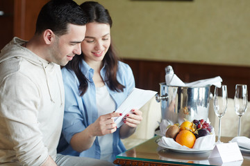 Young couple having rest in luxurious hotel