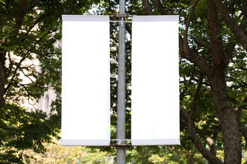 Large blank billboard on a street wall, banners with room to add your own text