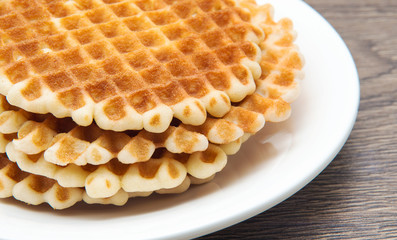 Waffles on a white plate.