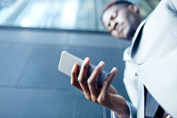 Mobile telephone in hand of businessman