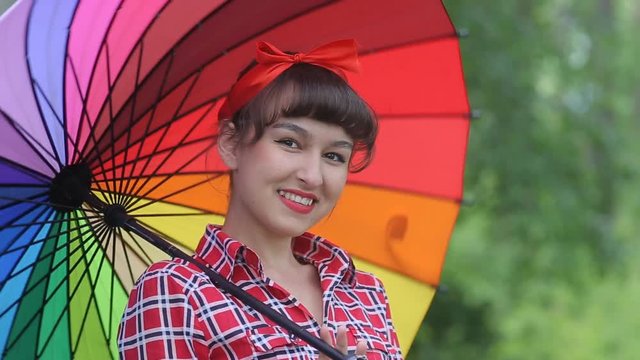 Beautiful lady in the style of a pinap with an umbrella