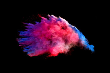 Bizarre forms of powder paint and flour combined  explode in front of a black background to give...