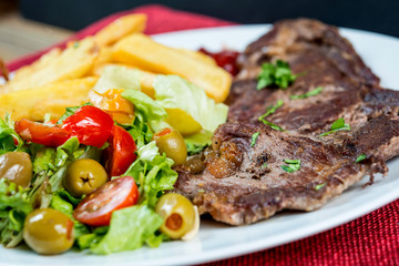 juicy steak beef meat with tomato and french fries