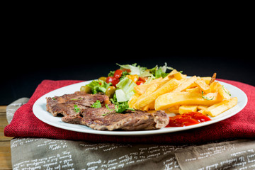 juicy steak beef meat with tomato and french fries