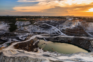 opencast mining quarry with beautiful sunlight and cloudy sky Aerial view industrial