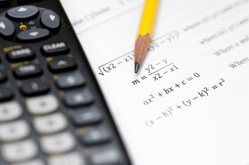 calculator and pencil isolated on a white background