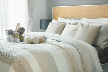 Obraz premium Modern classic interior bedroom with a lot of yarn balls on bed