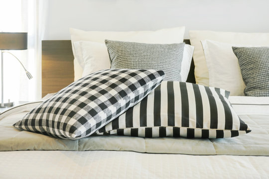 Black and white checked and strip pattern setting on bed