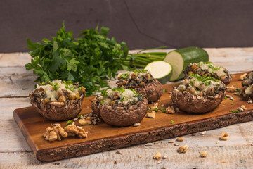 Mushroom caps stuffed with vegetables and cheese