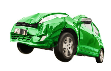 The green car has damaged the front. Traffic accident of a car isolated on white background. Flying car with broken part from crash.