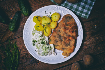 Pork cutlet with potatoes and cucumber salad