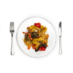 Sweet and sour chicken on a plate isolated on a white background.