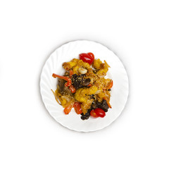 Sweet and sour chicken on a plate isolated on a white background.