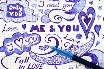 Hand drawn love doodles messages on checkered paper with ballpoint pen.