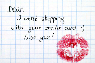 Note - Dear, I went shopping with  your credit card. Love you! with kiss.