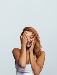 Fototapeta premium Beautiful african woman feeling happy in studio