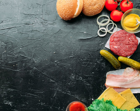 Ingredients For Burger. View From Above. Black Wood Background