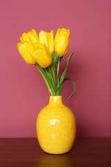 Bouquet of beautiful tulips on lilac color background