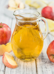 Apple Cider on wooden background (selective focus)