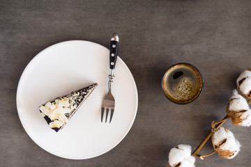 Healthy raw vegan chocolate coconut cake  from above on a gray background. Dark food photography...