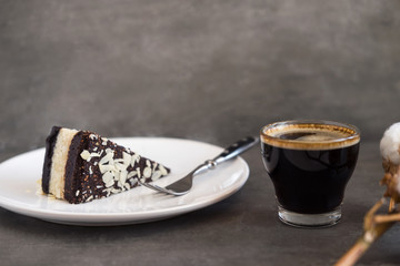 Healthy raw vegan chocolate coconut cake  on a gray concrete background. Dark food photography. Copy space