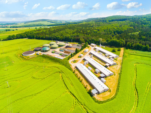 Aerial View Over Biogas Plant And Farm In Green Fields. Renewable Energy From Biomass. Modern Agriculture In Czech Republic And European Union. 