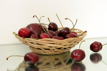 cherries in a wicker basket,