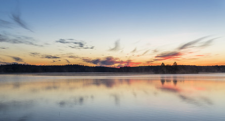 Obraz na płótnie Canvas Beautiful midsummer night in Finland next to lake