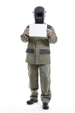Welder with a protective mask on his head demonstrates a blank card