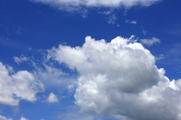 Naklejka na ściany i meble White puffy clouds in a blue sky over Florida