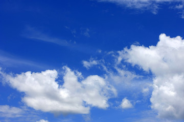 Naklejka na ściany i meble White puffy clouds in a blue sky over Florida
