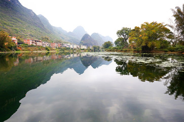 Fototapeta na wymiar Lake Reflection landscape in Yangshuo Guilin, China