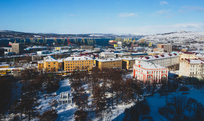 Fototapeta na wymiar Beautiful aerial air winter vibrant view of Murmansk, Russia, a port city and the administrative center of Murmansk Oblast, Kola peninsula, Kola Bay, shot from drone 