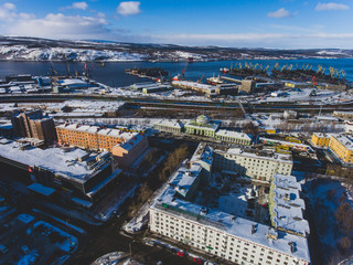 Beautiful aerial air winter vibrant view of Murmansk, Russia, a port city and the administrative center of Murmansk Oblast, Kola peninsula, Kola Bay, shot from drone
