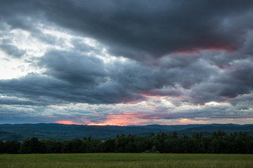 Dramatic Red Sunset Over Mountains
