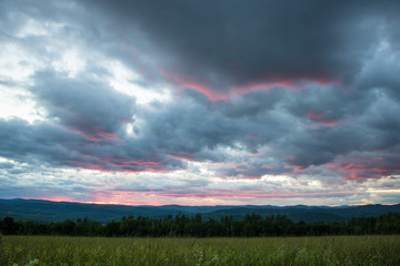 Fototapeta na wymiar Dramatic Red Sunset Over Mountains 