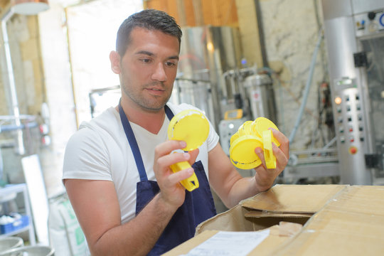 factory manager checking goods received