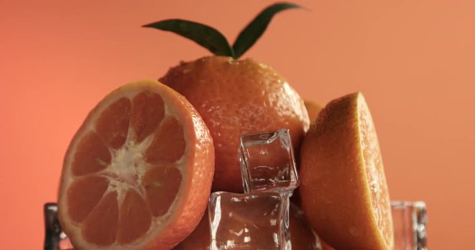 composition of fresh mandarins with ice cubes
