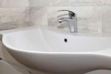 Bathroom interior with sink and faucet