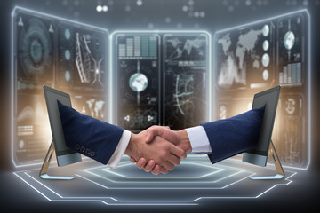 Two hands from screen in handshake concept