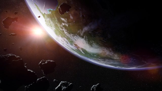 a swarm of asteroids moving towards planet Earth