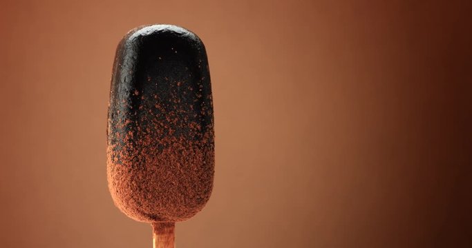chocolate ice cream on a stick turning on it's zxis