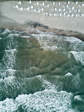 Aerial photo of waves on a stormy day with beach