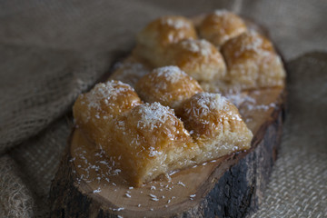 Tradional Turkish Dessert Baklava On a Wooden Plate Isolated