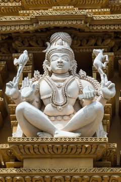 Nanjangud, India - October 26, 2013: Closeup Of White Statue Of Shiva As Adi Yogi On The Beige Gopuram Of Srikanteshwara Temple.