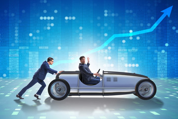 Businessman car pushing in teamwork concept