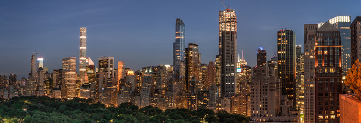 Night Scene of Central Park South Skyline with illuminated buildings - obrazy, fototapety, plakaty